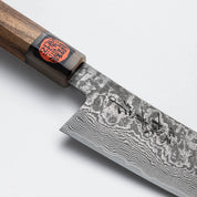 Shigeki Tanaka SG-2 Santoku Zebrano markolattal.